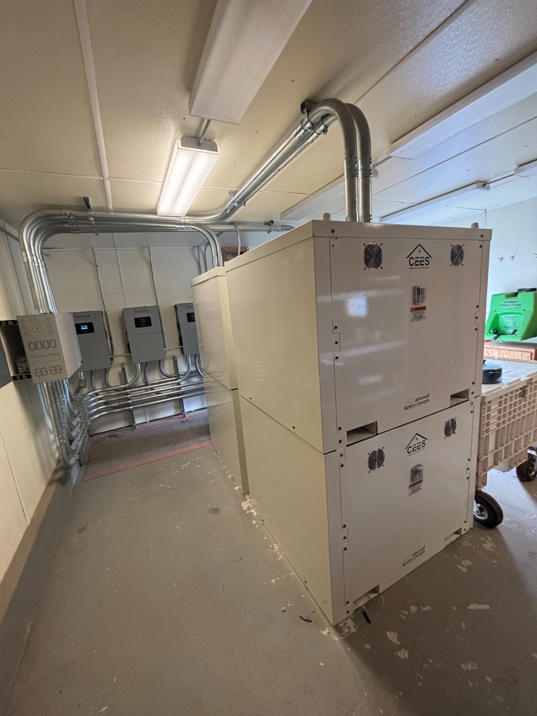 CEES-R unit stacked two-high with inverter array and conduit at Manitou Islands battery room