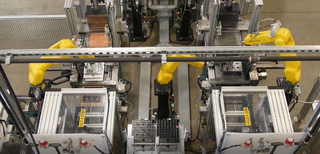 Dual FANUC robotic arms on automated bipolar plate pasting line